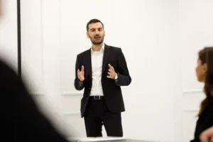 Man with opened hands explaining details